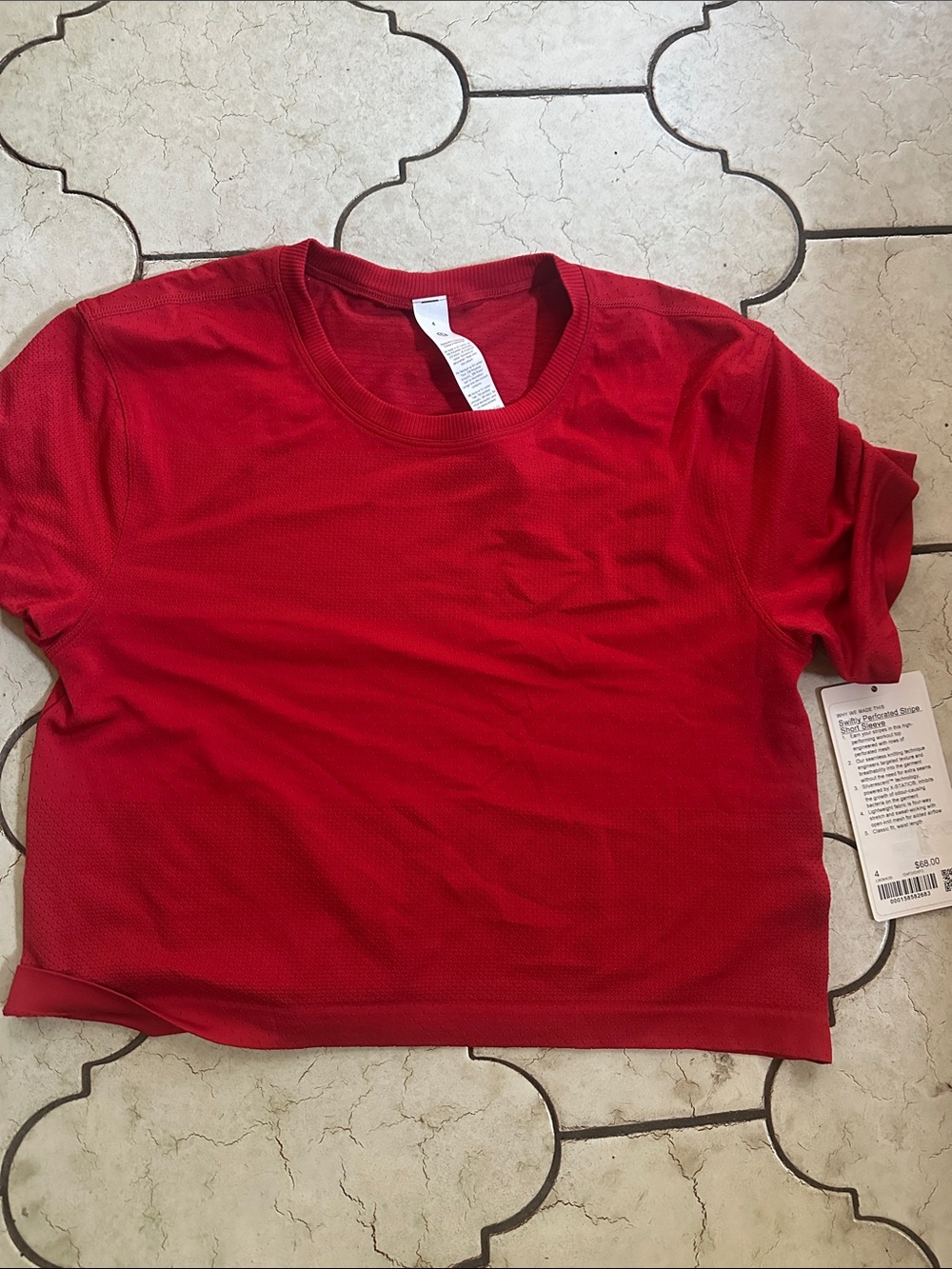 Lululemon Swiftly perforated stripe short sleeve. Oxford red size 4